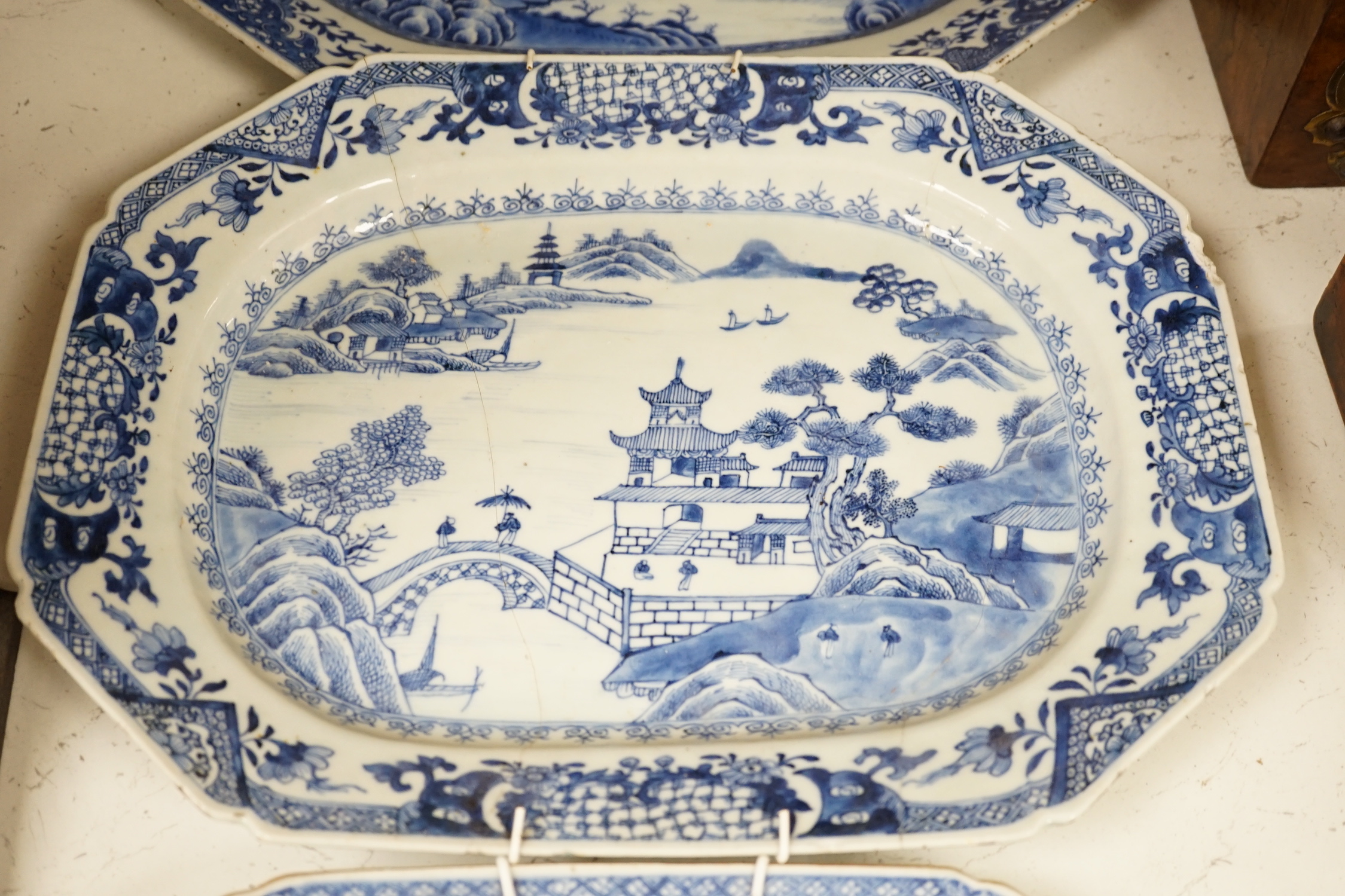 Three 18th century Chinese blue and white meat plates, largest, 41.5cm wide, 35cm deep (a.f.)